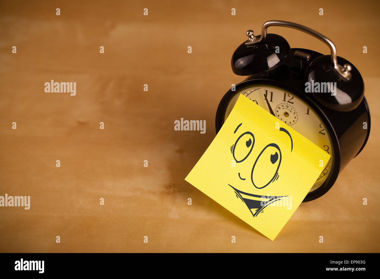 Post-it note with smiley face sticked on a clock Stock Photo - Alamy