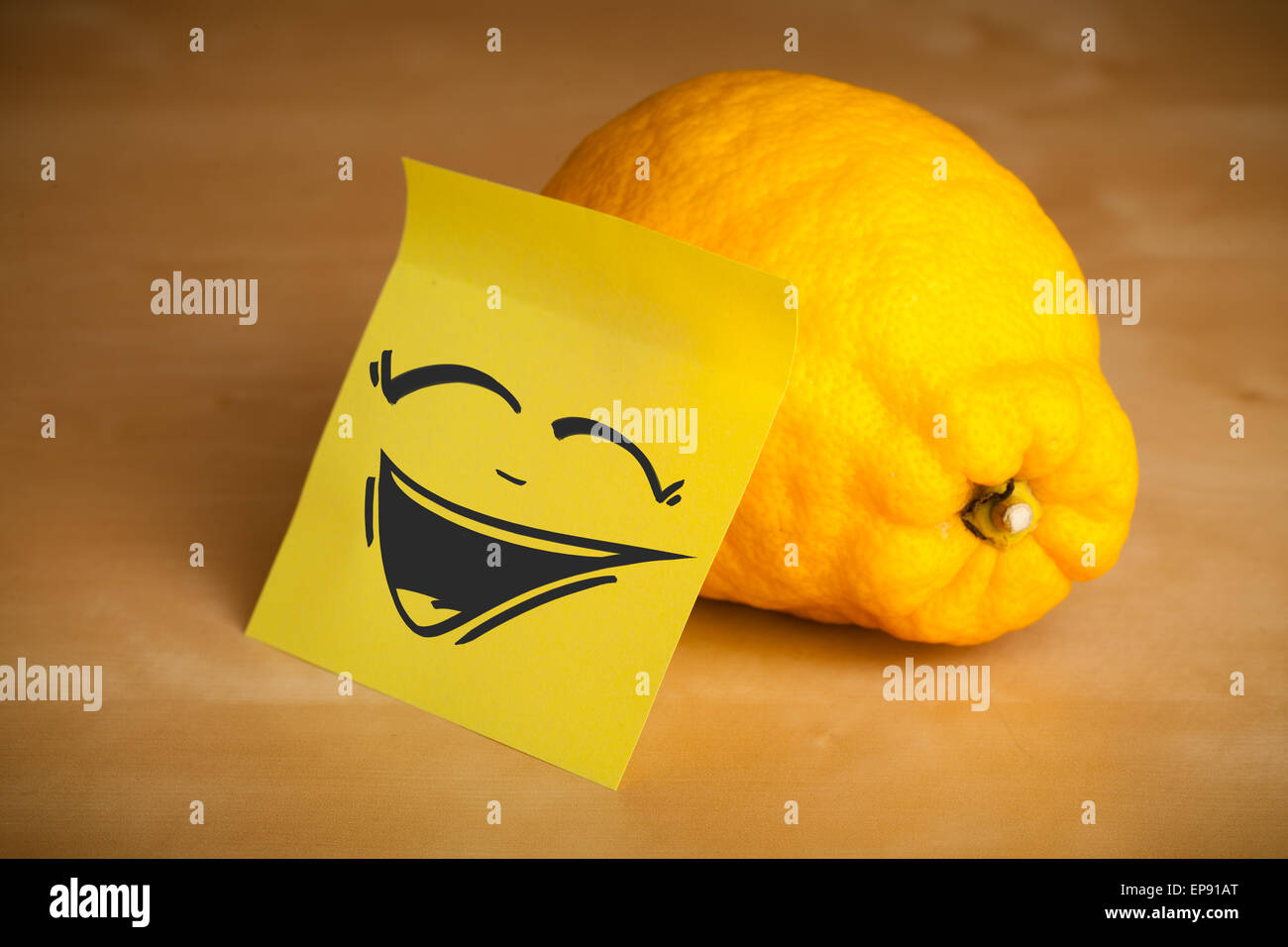 Postit note with smiley face sticked on lemon Stock Photo Alamy