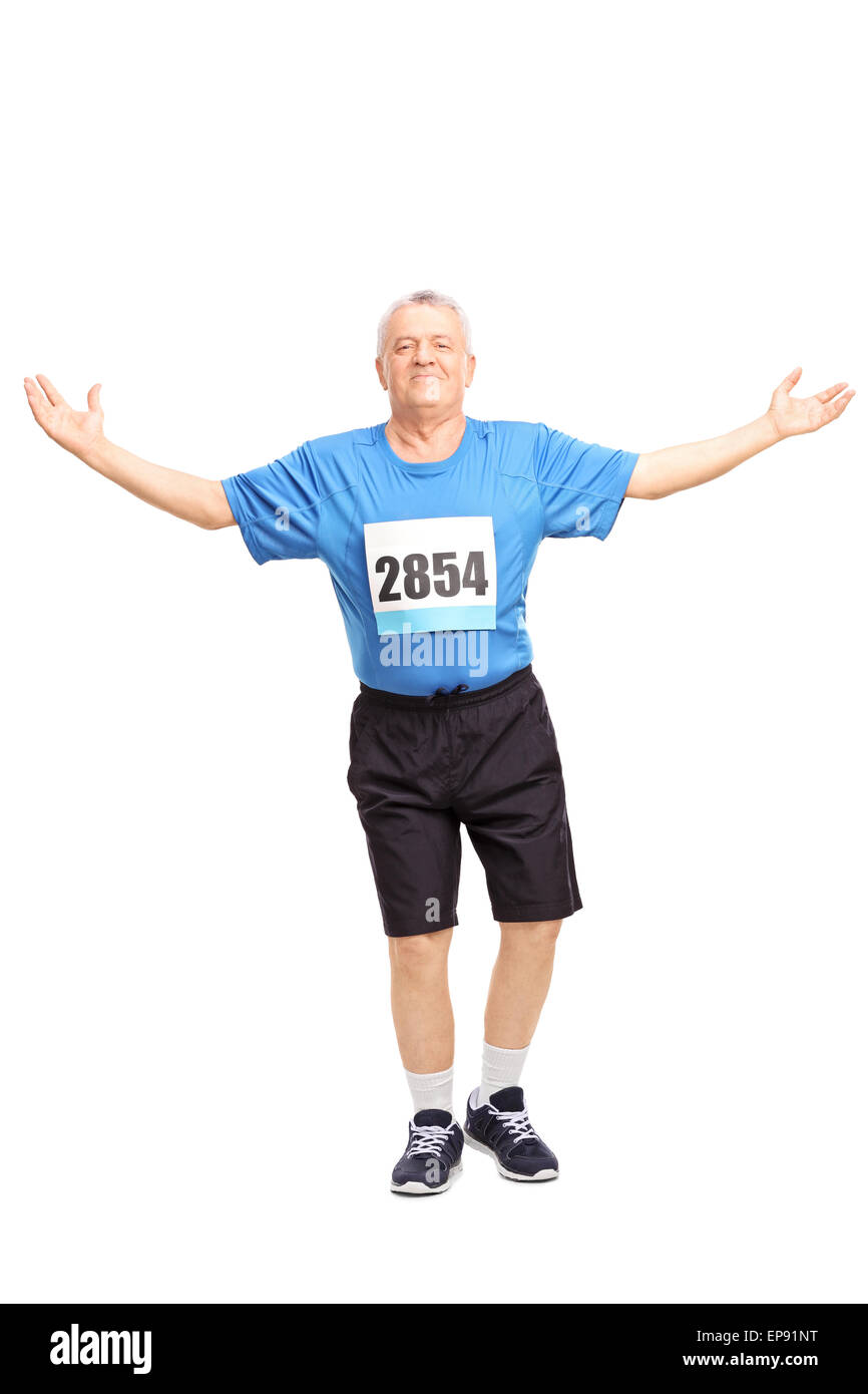 Full length portrait of a mature runner finishing a race and celebrating his victory isolated on white background Stock Photo
