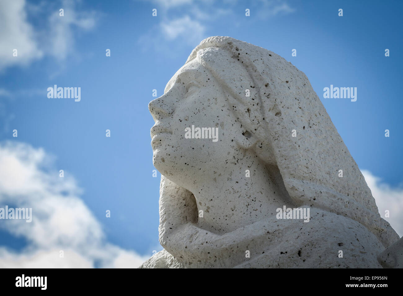 sculpture of a woman praying.Cerro de los Angeles is located in the municipality of Getafe, Madrid. It is considered the geograp Stock Photo