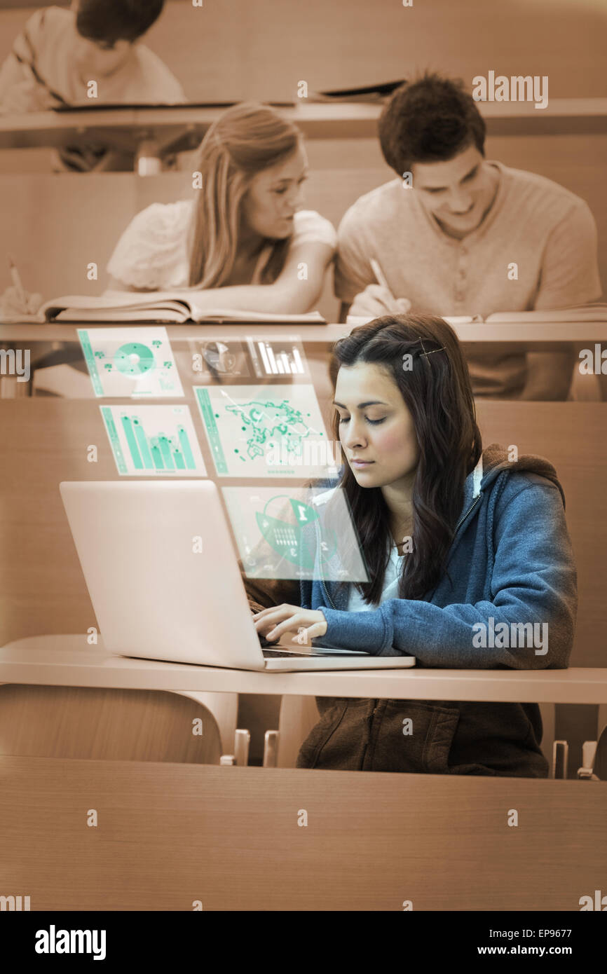 Pretty brunette studying on her futuristic computer Stock Photo