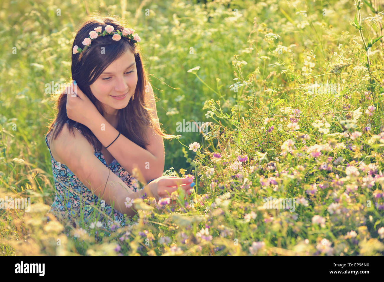 Beautiful teenage girl on the summer field Stock Photo