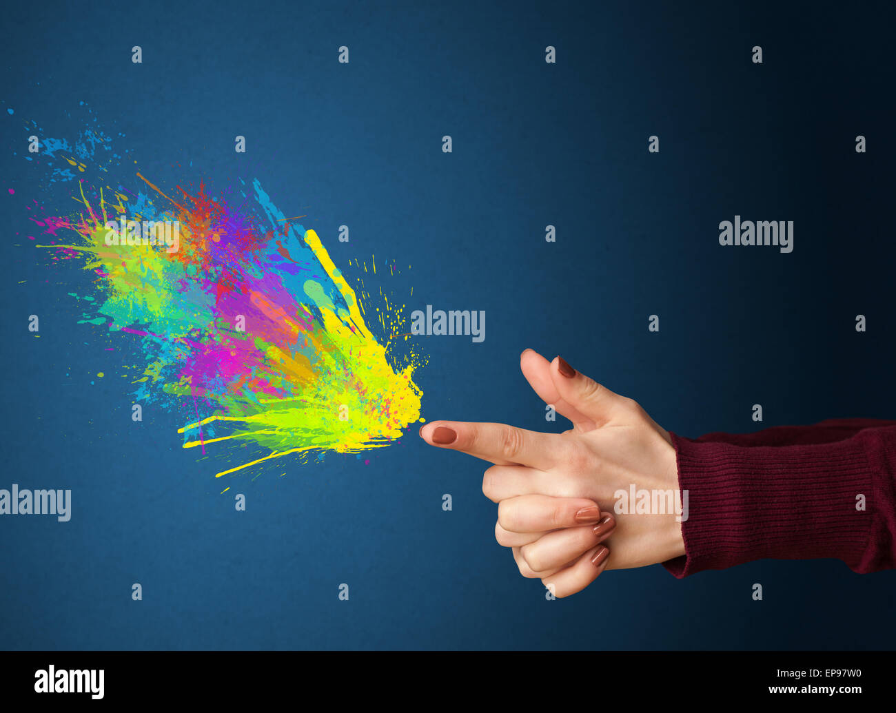 Colorful splashes are coming out of gun shaped hands Stock Photo - Alamy