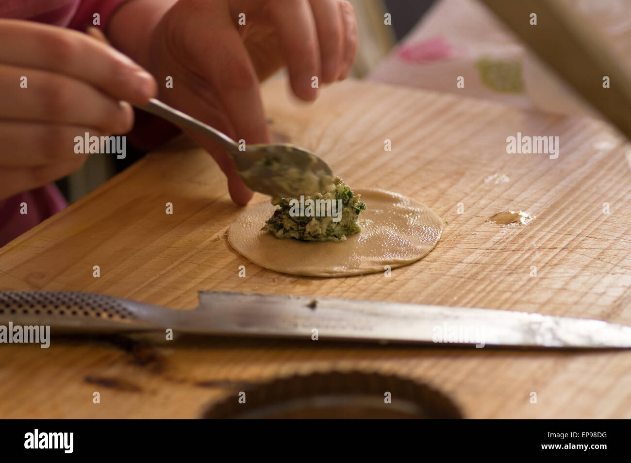 Putting the filling into home made Tortellini. Stock Photo