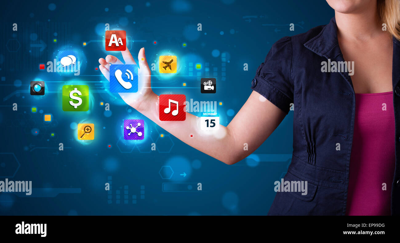 Woman pressing various collection of high tech buttons Stock Photo - Alamy