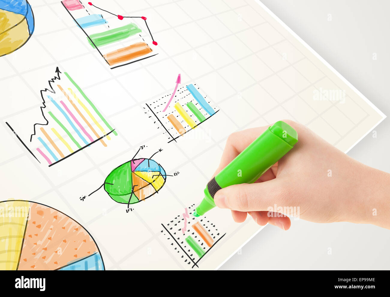Business person drawing colorful graphs and icons on paper Stock Photo ...