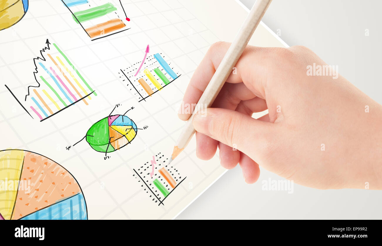 Business person drawing colorful graphs and icons on paper Stock Photo ...