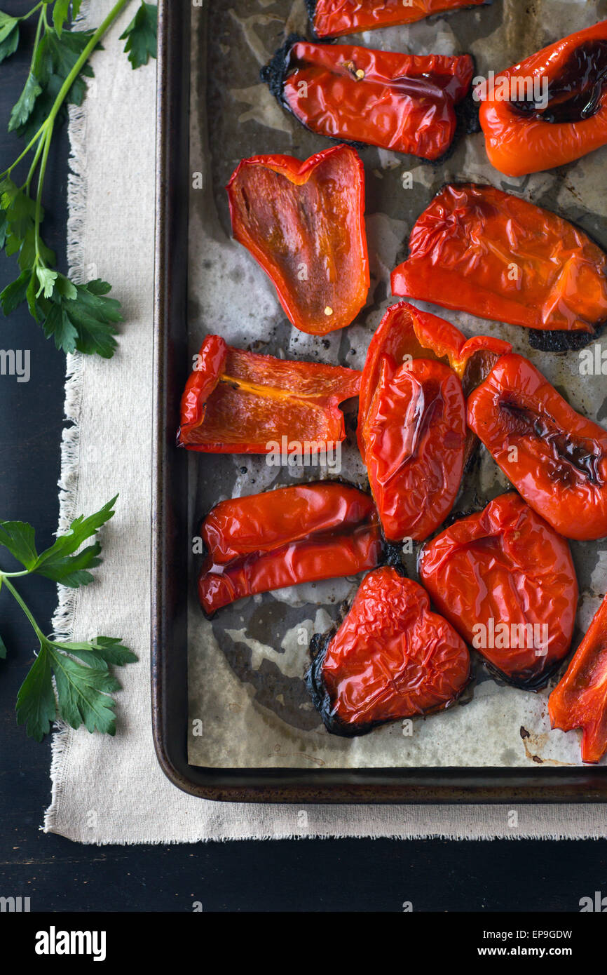 Oven roasted red peppers right after they came out of the oven. Stock Photo