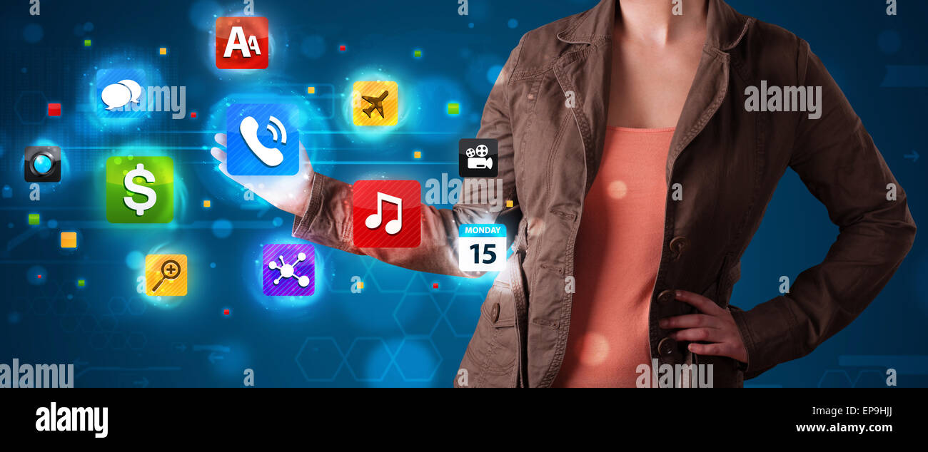 Woman pressing various collection of high tech buttons Stock Photo - Alamy