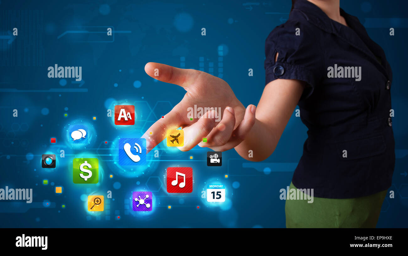 Woman pressing various collection of high tech buttons Stock Photo - Alamy