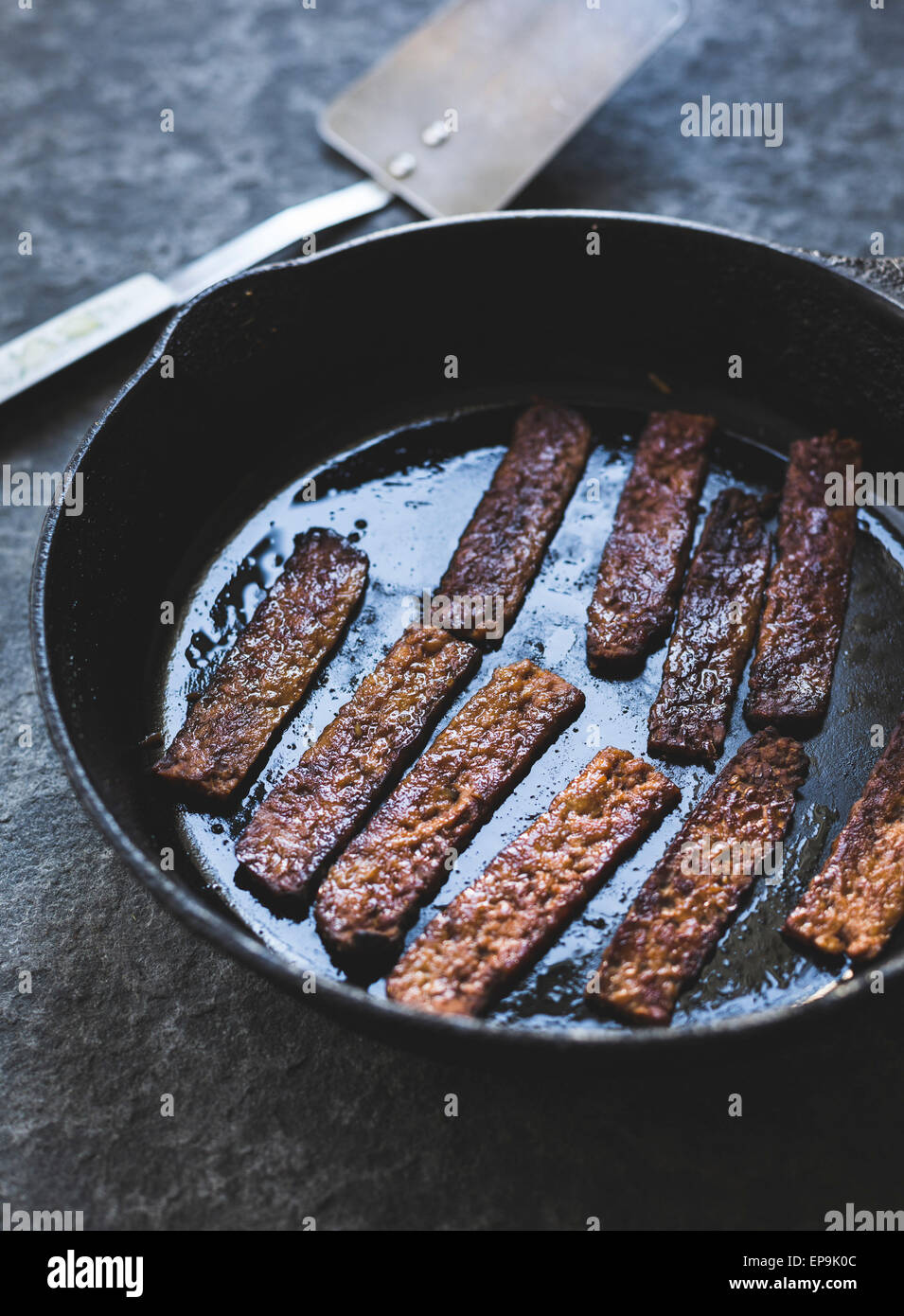 Tempeh strips in a skillet Stock Photo