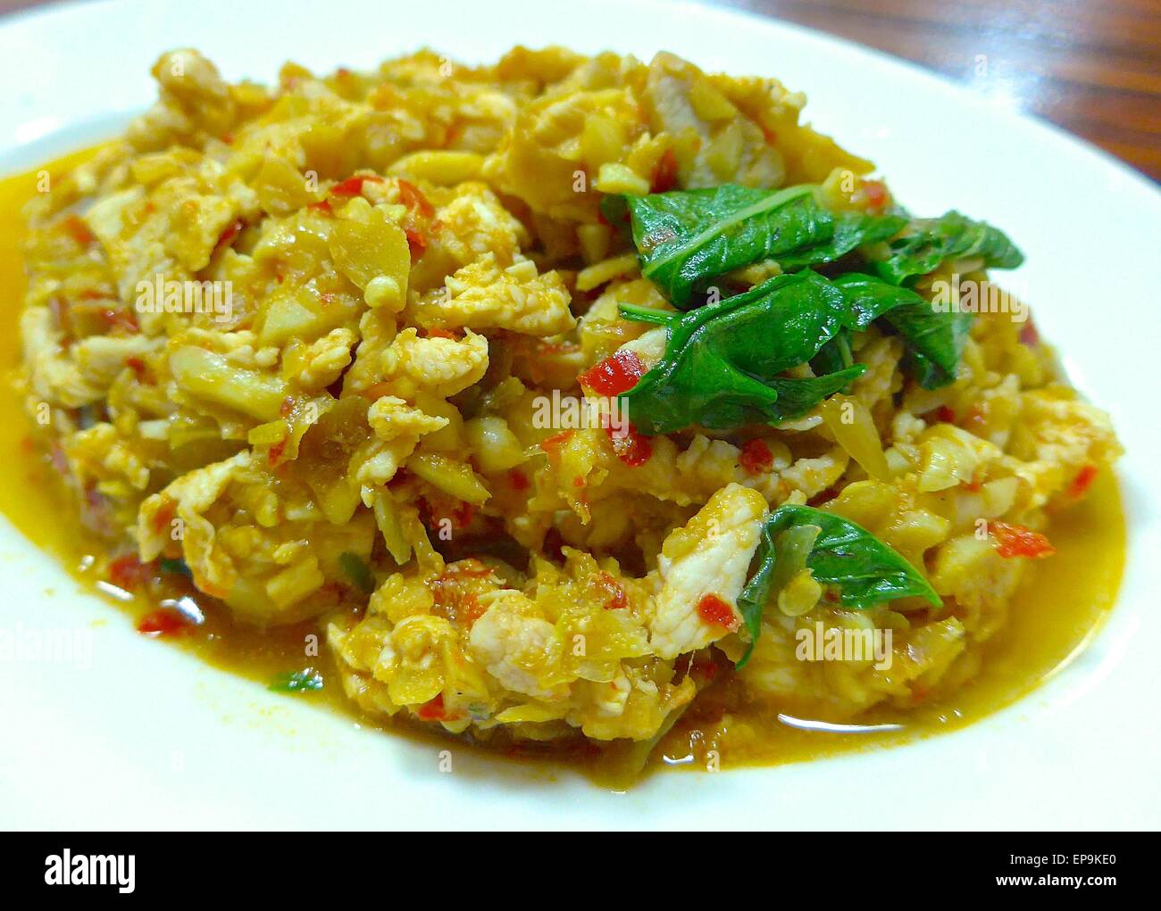 The closeup of stir fried chicken with holy basil The closeup of stir