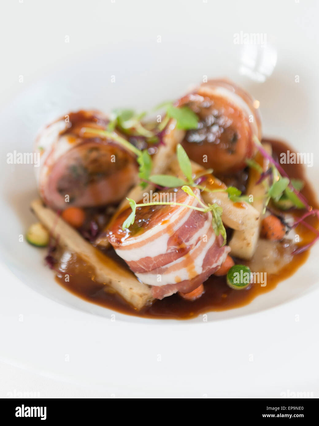 Baked loin of rabbit and pancetta. Chestnut and sage stuffing, shallot