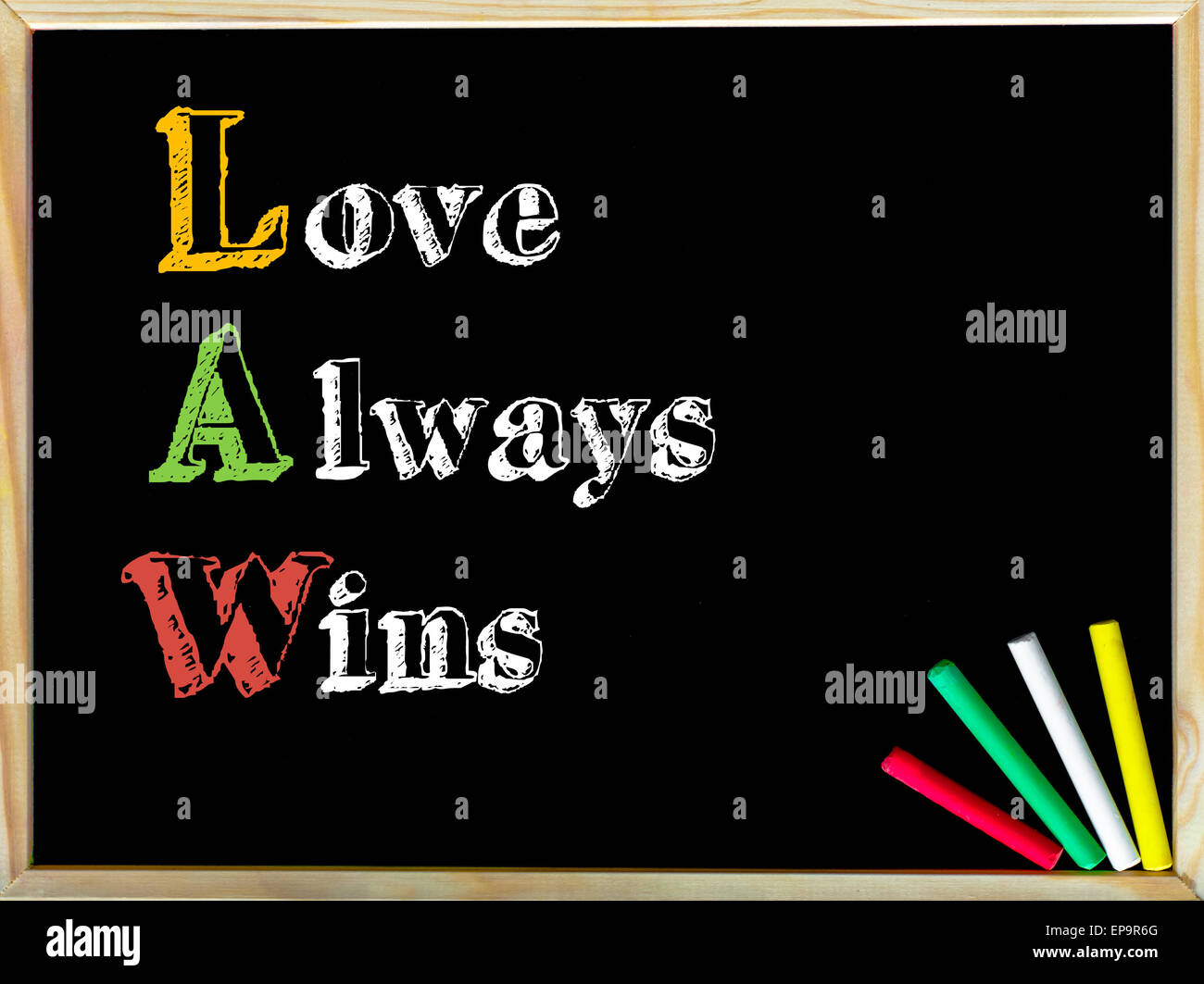 Acronym LAW as LOVE ALWAYS WINS. Written note on wooden frame blackboard,  colored chalk in the corner. Motivational Concept image Stock Photo - Alamy