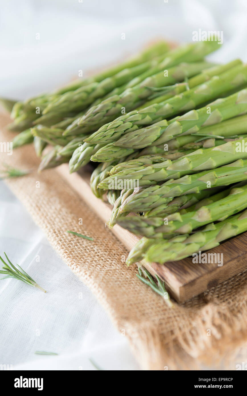 Asparagus spears on a chopping board. Stock Photo