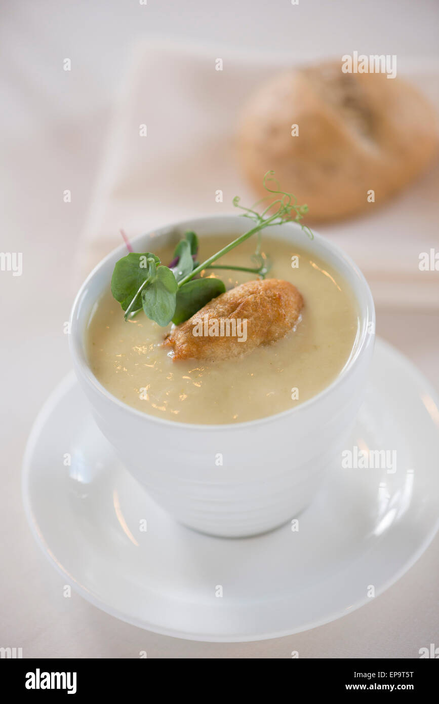 Leek and potato soup with smoked haddock beignet. Stock Photo