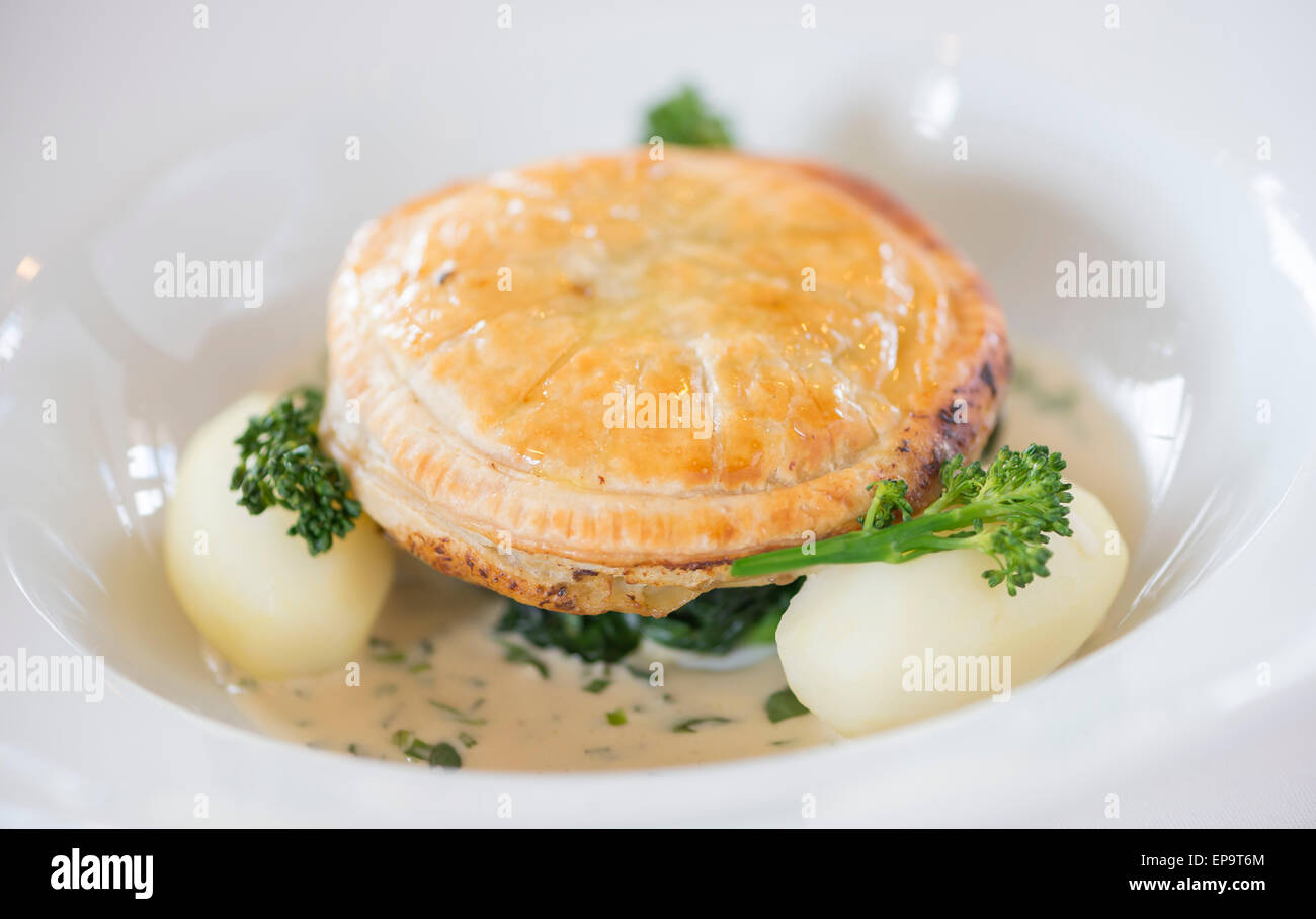 Wild Mushroom Pithivier with butttered spinach and tarragon cream sauce Stock Photo Alamy