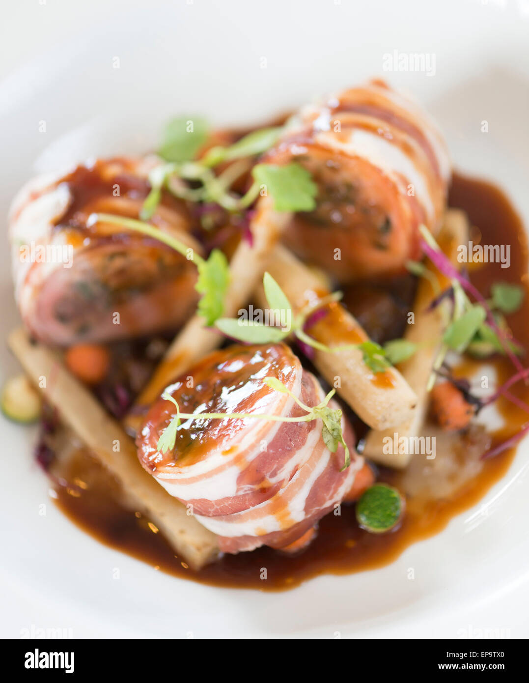 Baked loin of rabbit and pancetta. Chestnut and sage stuffing, shallot