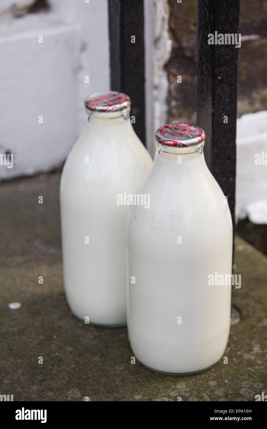 milk bottles on doorstep Stock Photo