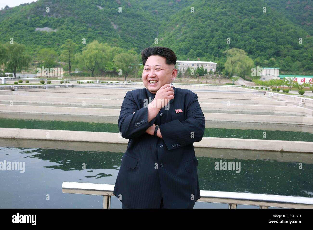 Pyongyang. 15th May, 2015. Photo provided by Korean Central News Agency (KCNA) on May 15, 2015 shows top leader of the Democratic People's Republic of Korea (DPRK) Kim Jong Un recently inspecting Sinchang fish farm under Unit 810 of the Korean People's Army (KPA). Credit:  KCNA/Xinhua/Alamy Live News Stock Photo