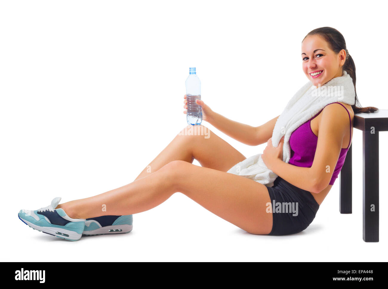 Young sporty woman with towel and water bottle isolated Stock Photo - Alamy