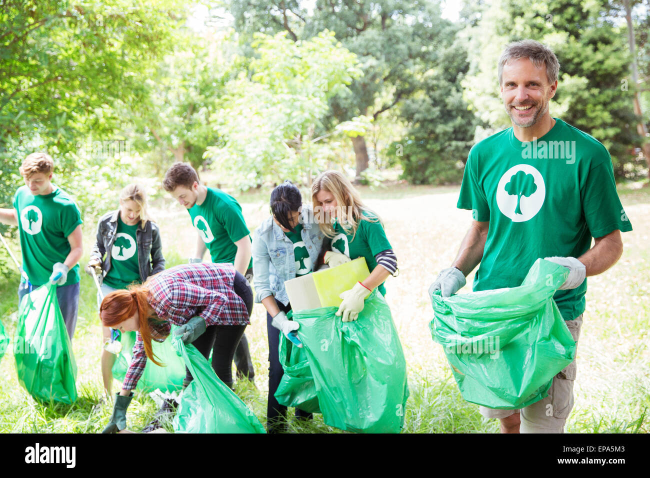 environmentalist volunteer picking up trash Stock Photo Alamy