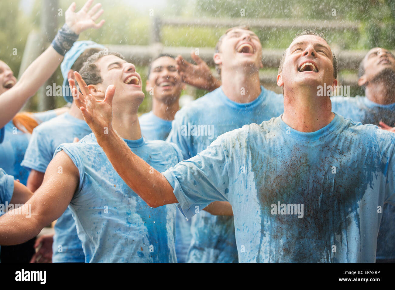 enthusiasm team enjoying rain boot camp Stock Photo