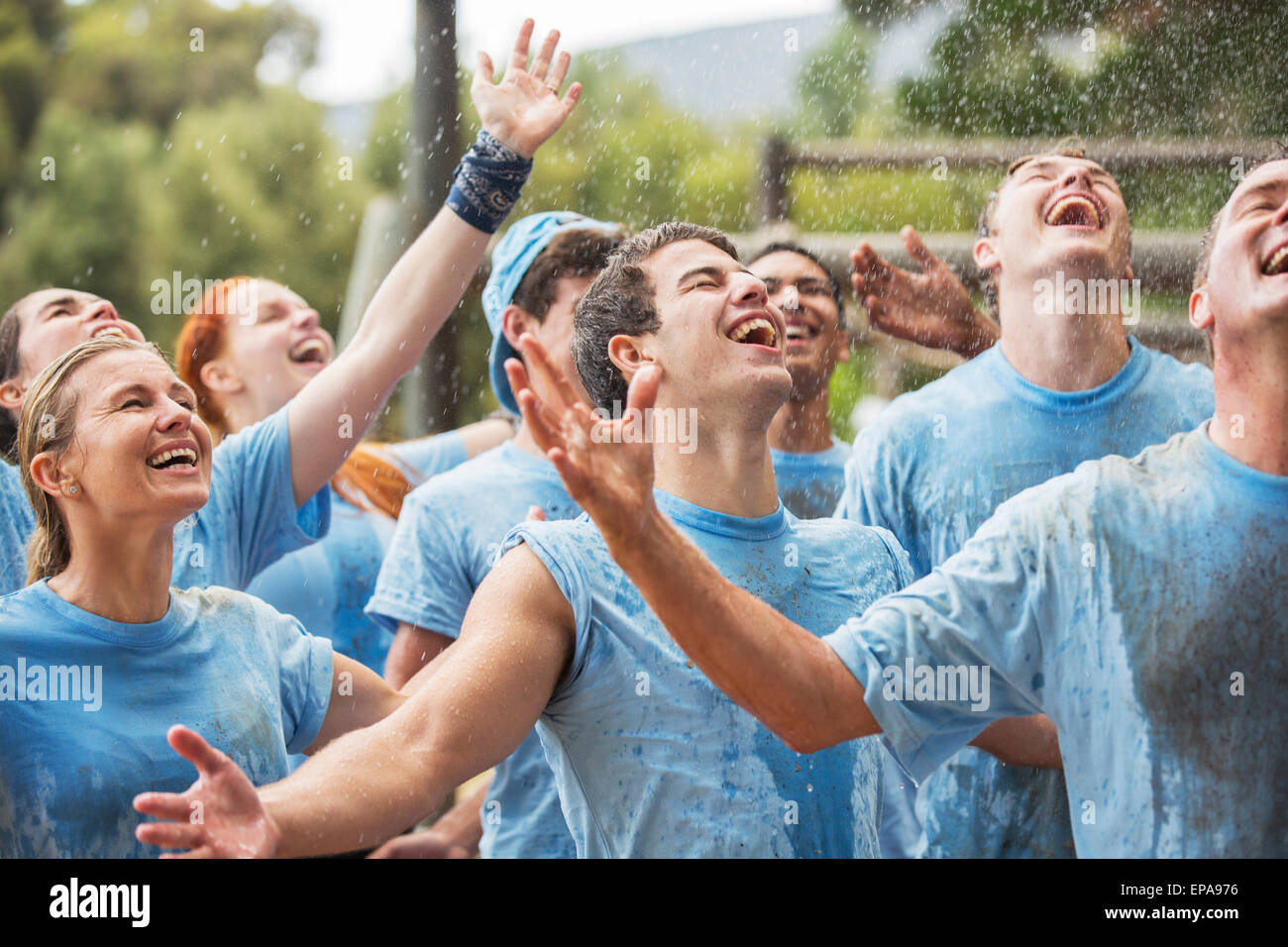 enthusiasm team enjoying rain boot camp Stock Photo