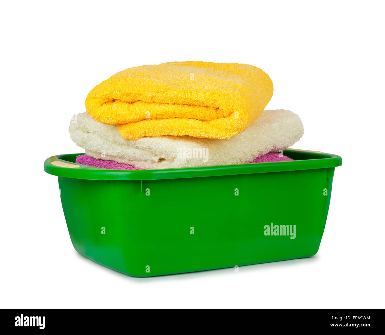 Stack of clean fresh towels in the green basin isolated on white background Stock Photo