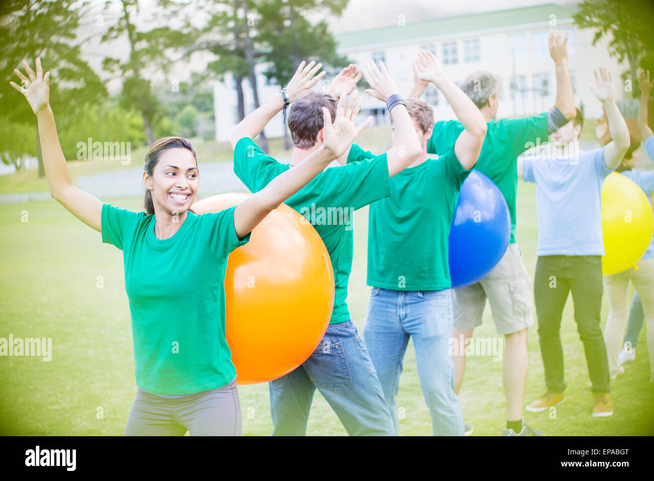 performing fitness ball team building activity Stock Photo
