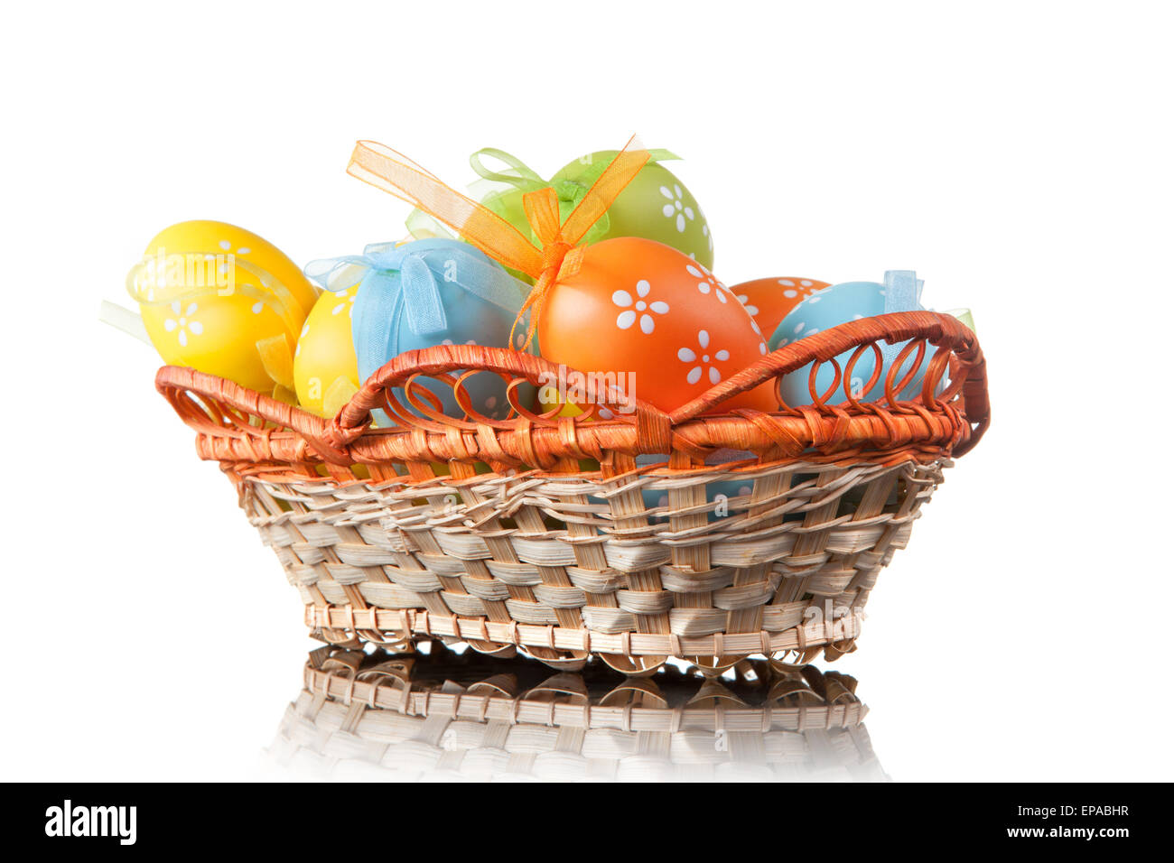 color easter eggs in basket isolated on white Stock Photo - Alamy