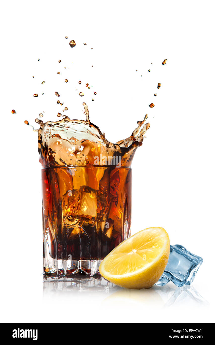 splash of cola in glass with lemon and ice isolated on white Stock ...