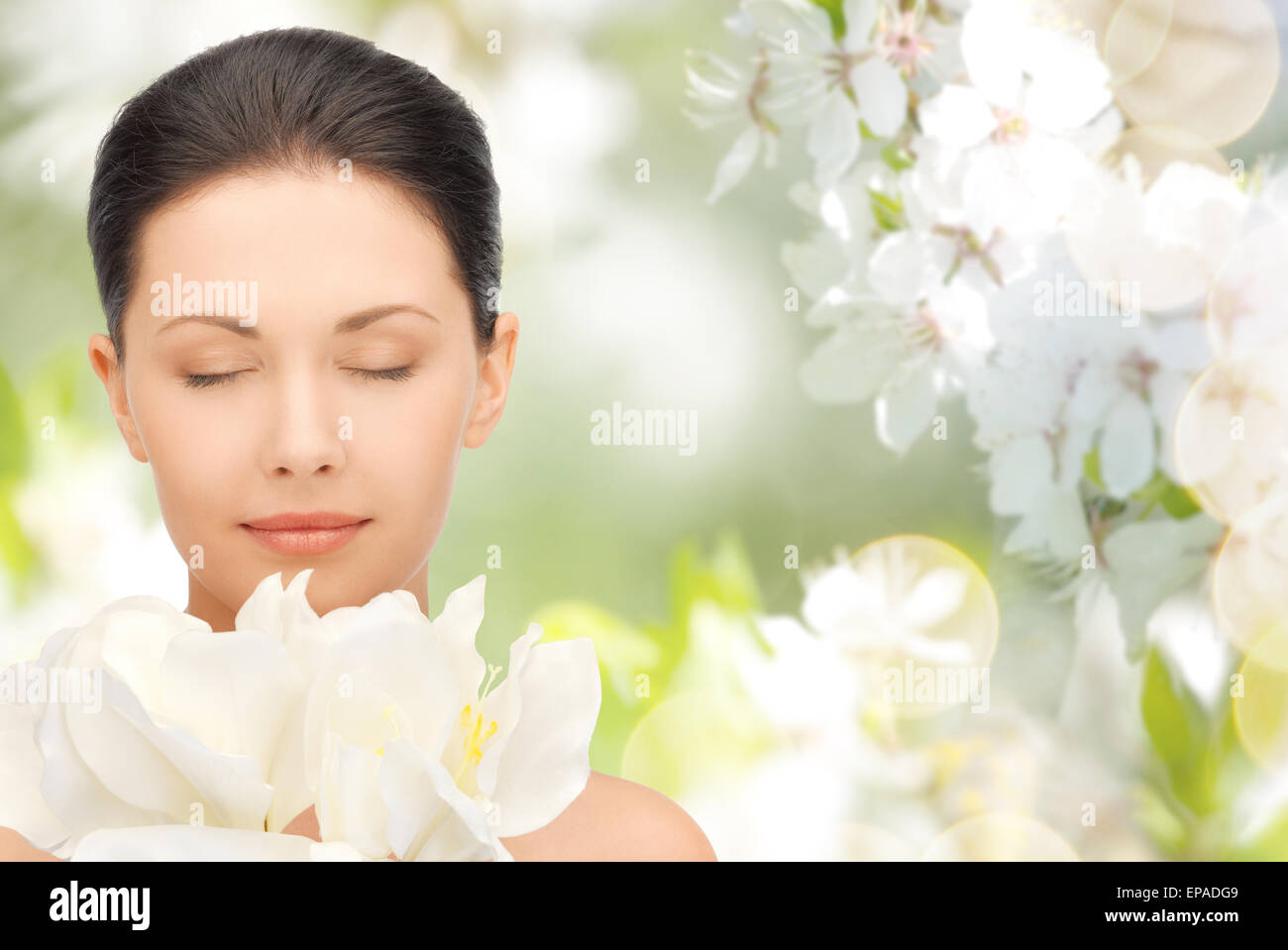 beautiful woman smelling flowers with closed eyes Stock Photo - Alamy