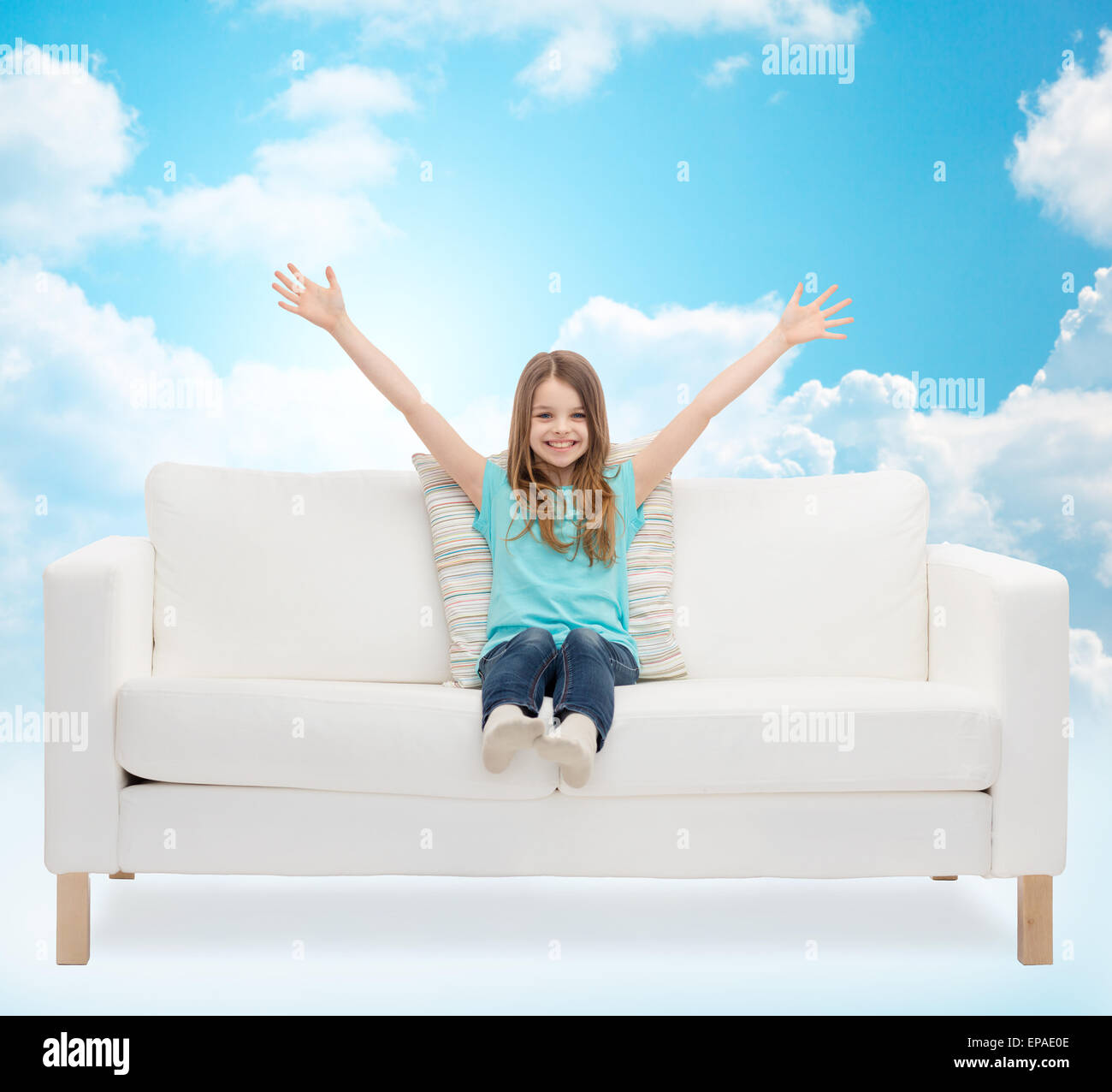 Happy child girl sitting sofa hi-res stock photography and images - Alamy