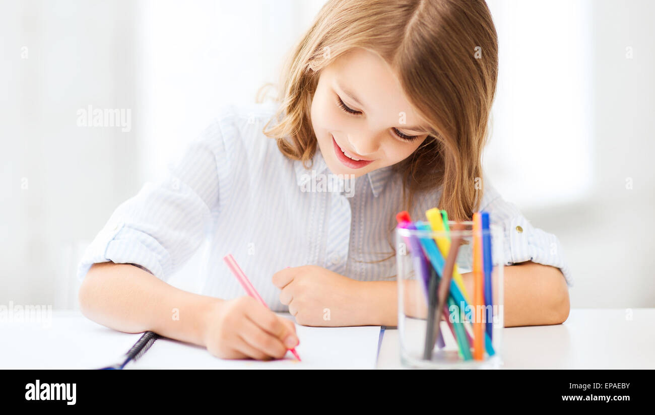 little student girl drawing at school Stock Photo - Alamy