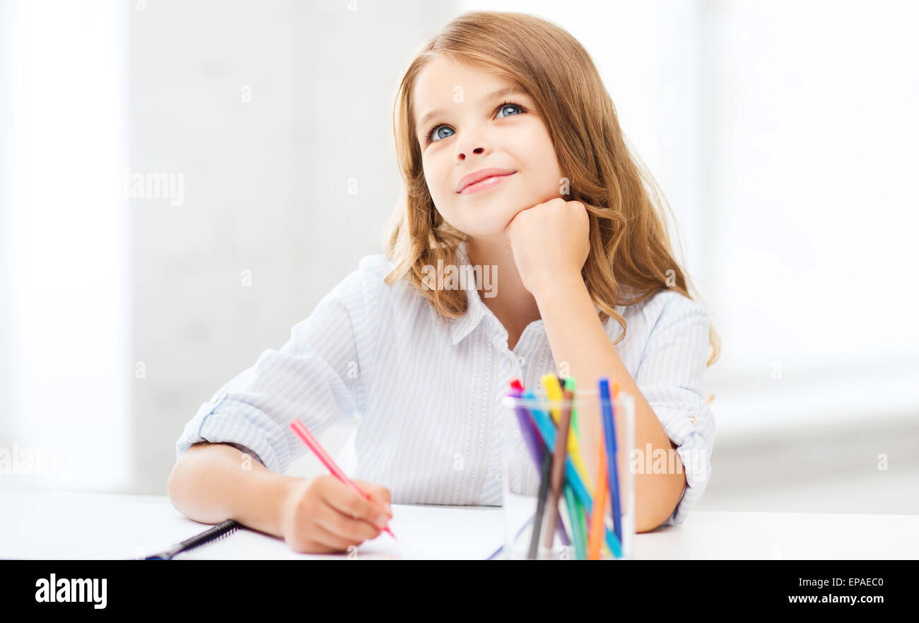 little student girl drawing at school Stock Photo - Alamy