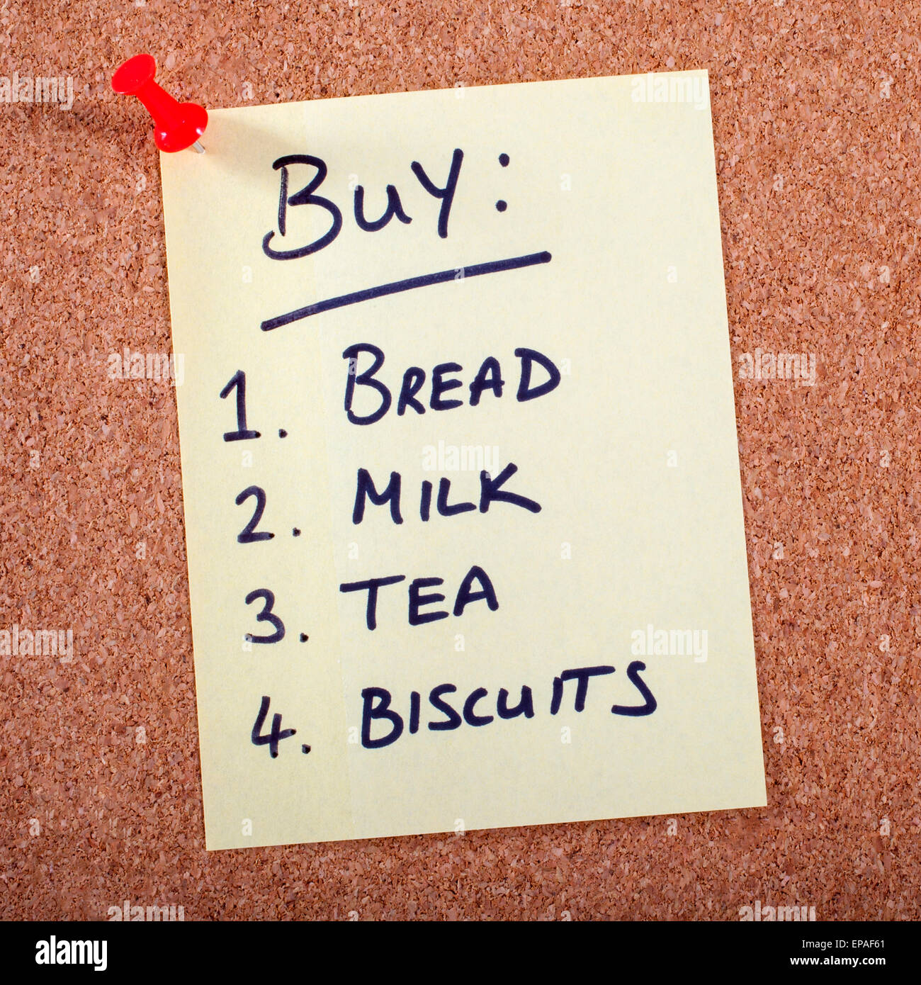 A Shopping List pinned to a Noticeboard. Stock Photo