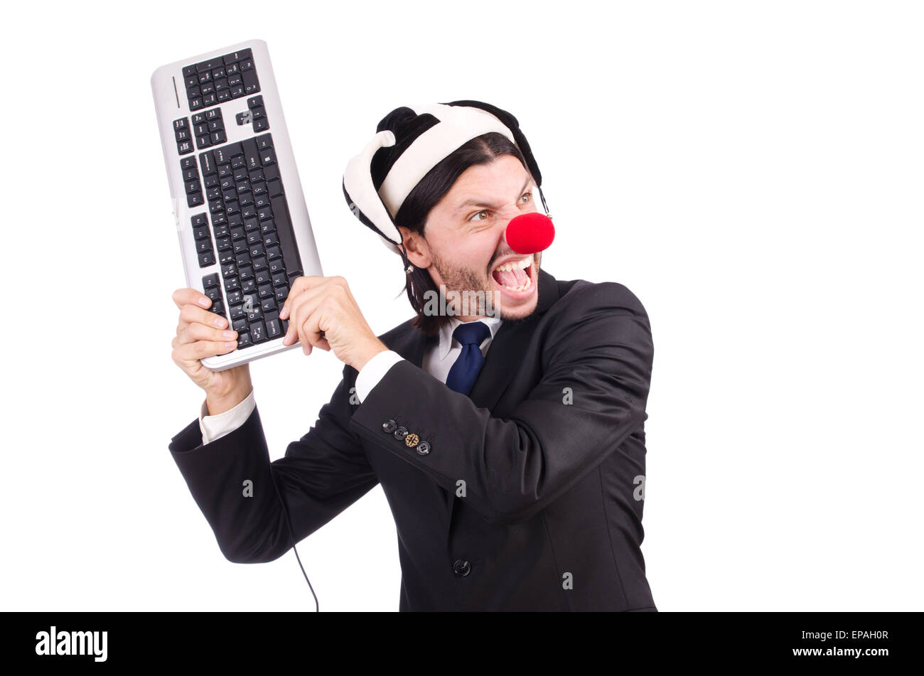 Funny clown with keyboard isolated on white Stock Photo Alamy