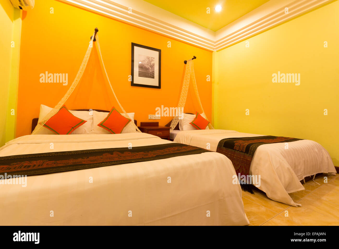 Hotel room yellow tone decorate comtemporary style Stock Photo Alamy