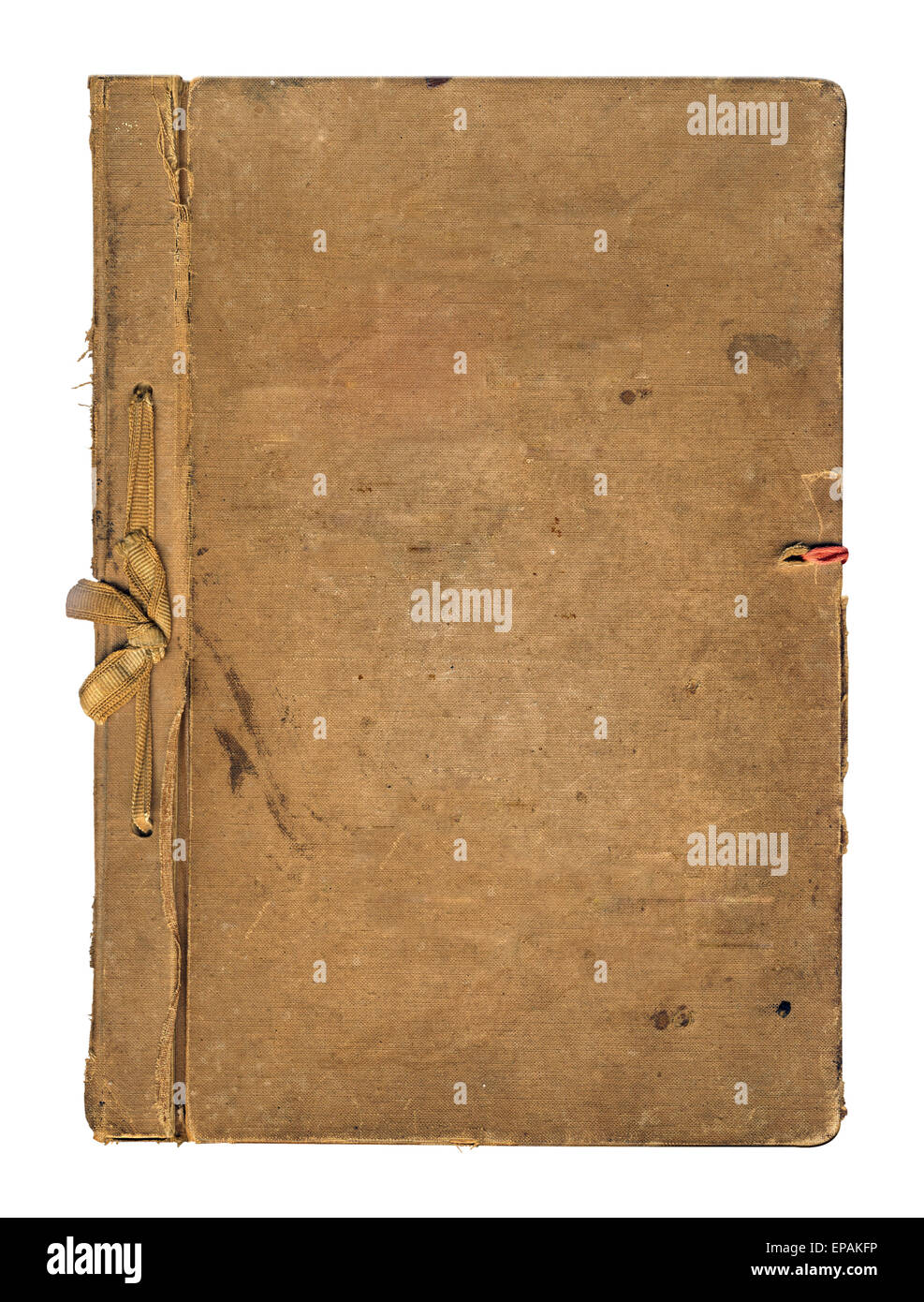 Old worn book cover with ribbon and bow isolated on white background
