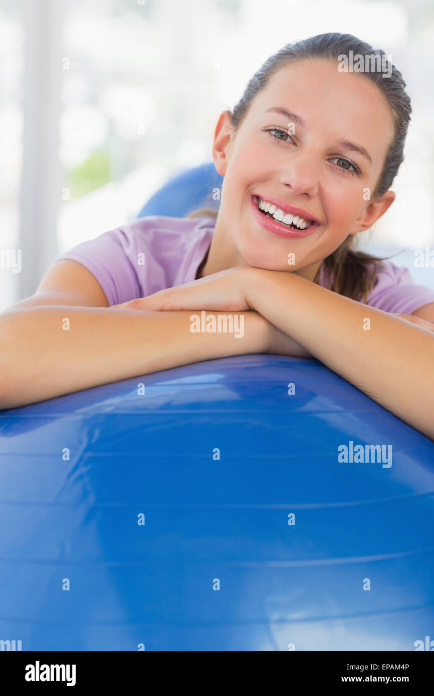 Portrait of a smiling fit woman with exercise ball Stock Photo - Alamy