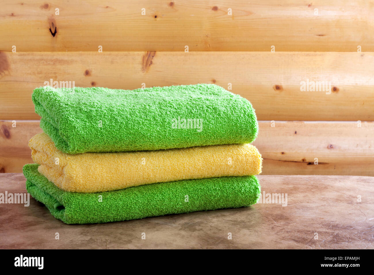 Traditional wooden sauna for relaxation with set of clean towels Stock Photo