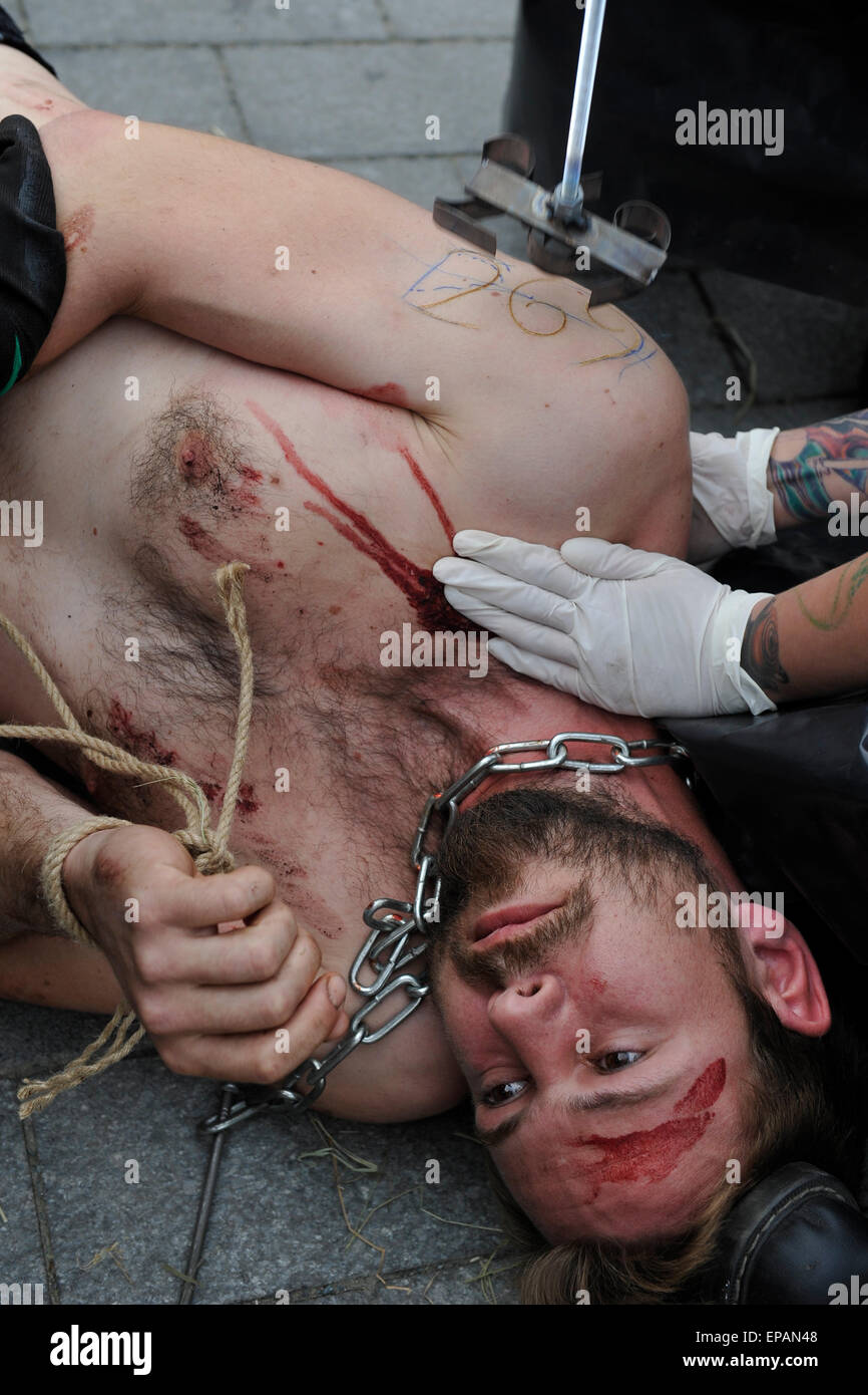 Brno, Czech Republic. 15th May, 2015. Animal rights activist from Czech section of 269Life movement performs a public protest action against maltreatment of animals at large farms in Brno, Czech Republic, Friday, May 15, 2015. About ten activist get burnt a sign of the number 269 on their bodies. Credit:  Vaclav Salek/CTK Photo/Alamy Live News Stock Photo