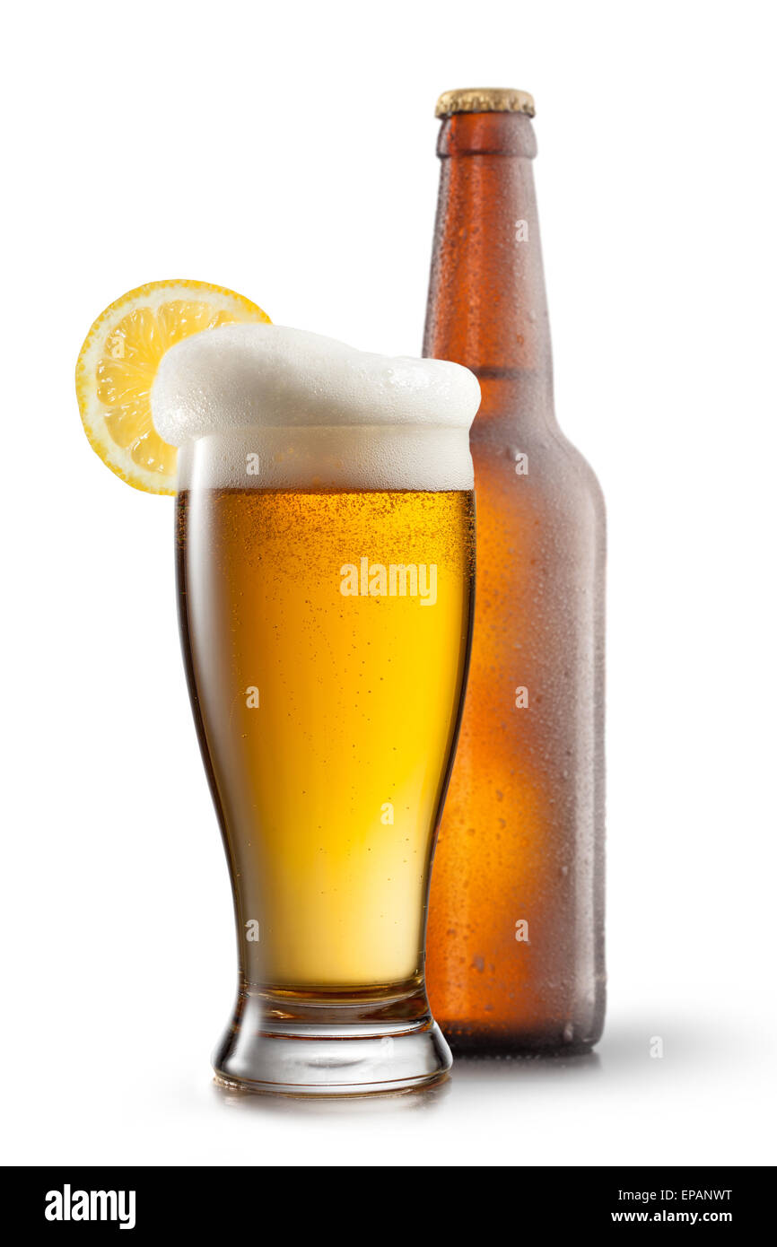 Beer in glass with lemon and bottle isolated on white Stock Photo Alamy