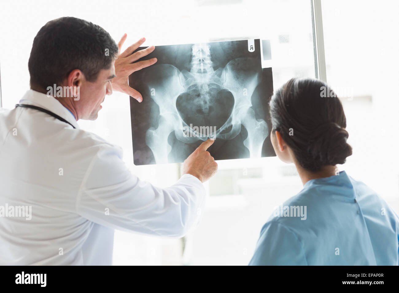 Medical team examining xray Stock Photo - Alamy