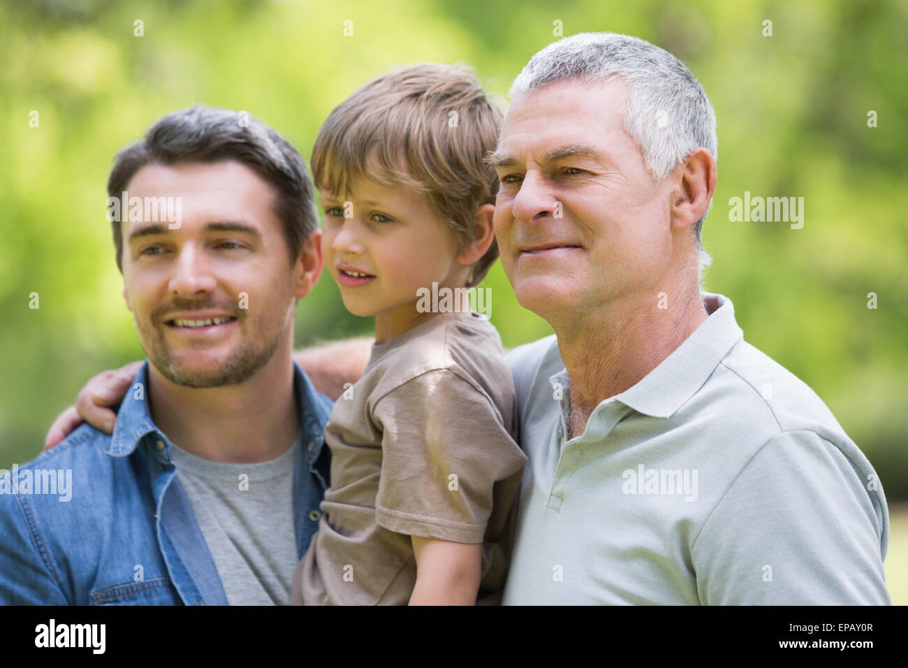 Grandfather father and son smiling at park Stock Photo - Alamy