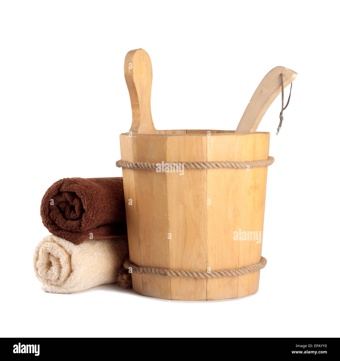 Wooden bucket with ladle for the sauna and stack of clean towels Stock Photo