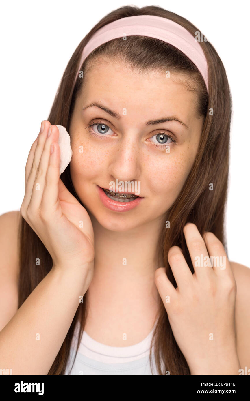 Girl cleaning face with cotton pad isolated Stock Photo Alamy