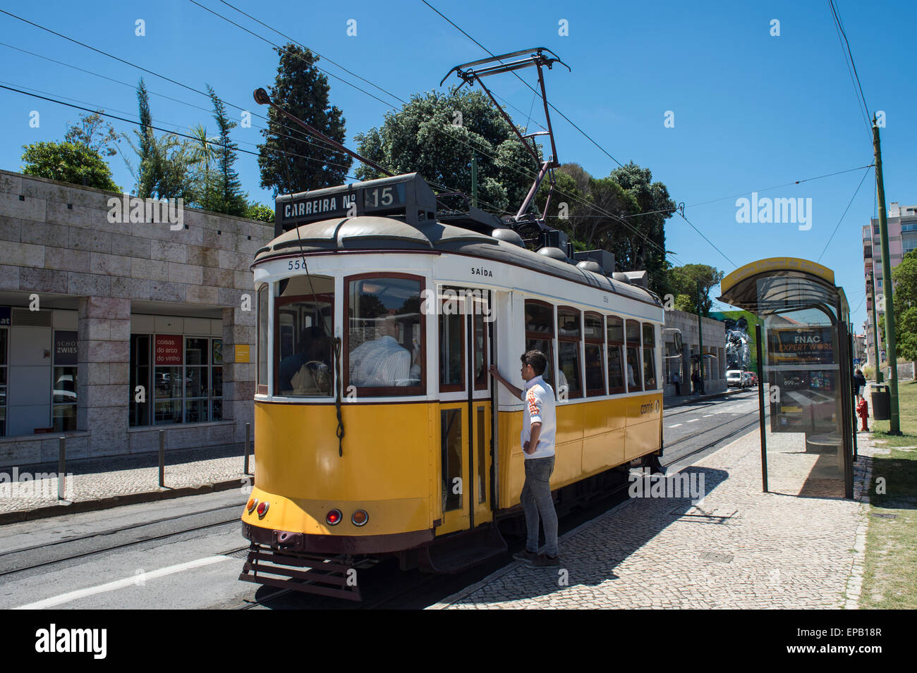 number 15 tram stopped at a bus stop in the belem district of Lisbon Portugal Stock Photo