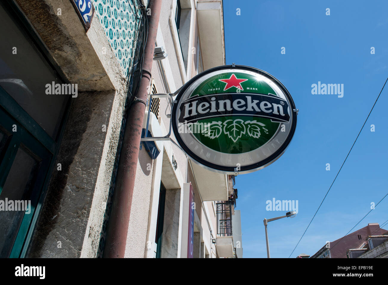 Green Heineken beer sign hanging outside a bar Stock Photo